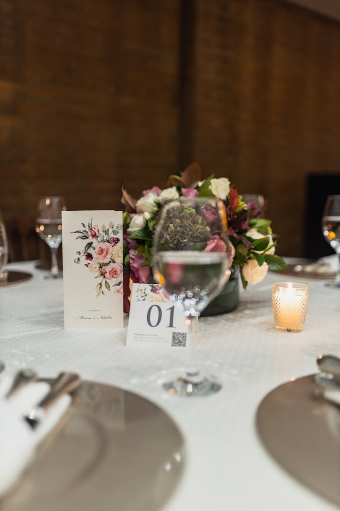 Luxurious table setting with a floral centerpiece and candlelight ambiance, perfect for upscale dining.